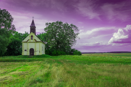 Lonely little church in the middle of field between the villages of Rokitno and Lubikowo - Polandの写真素材