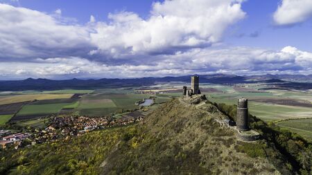 Castle Hazmburk. Ruines of Hazmburk castle on top of mountain peak of Ceske Stredohori range. Medieval castle with views on czech countryside landscape near village Klapy, Libochovice, Czech Republic.の写真素材