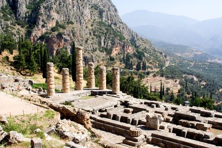 ruined columns of ancient temple in delphi greeceの写真素材