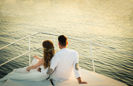 Just married couple on yacht. Happy bride and groom on their wedding dayの写真素材