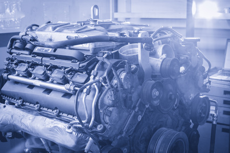 Professional car mechanic working in auto repair service.