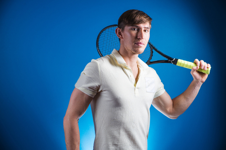 Portrait of tennis player man. front view. looking at camera. on the courtの写真素材