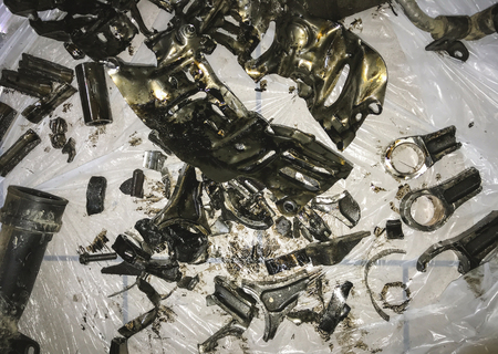 Close up in front of the old red car accident, which suffered a collision with another vehicle that was damaged severely.の写真素材