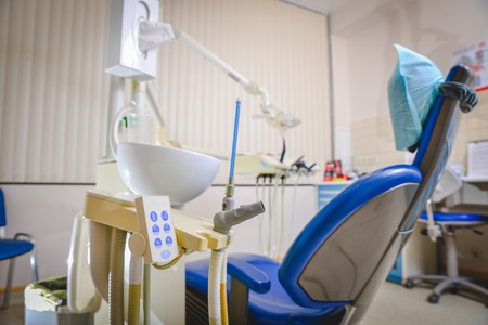 Dental clinic: room with dental chair and medical equipmentの写真素材