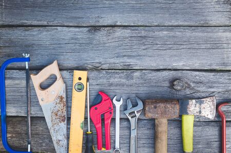 Set of tools over a wood panel with space for textの写真素材