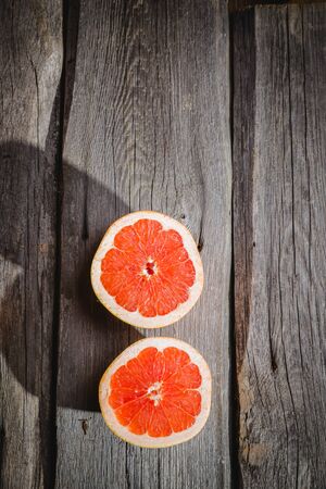 grapefruit on a wooden backgroundの写真素材