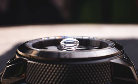 Water resistant wrist watch with rain dropsの写真素材