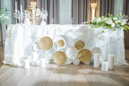 A very nicely decorated wedding table with plates and serviettes.の写真素材