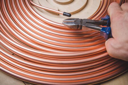 Industry system men worker cut joint with tool of copper pipe air conditionerの写真素材