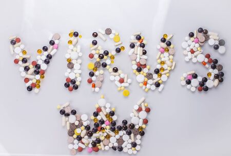 Pharmacy background on a black table. Tablets on a black background. Pills. Medicine and healthy. Close up of capsules. Different kind of medicinesの写真素材