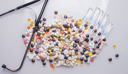 Gauze, ace bandage, tape, scissors and bandages shot on white background with a soft shadowの写真素材