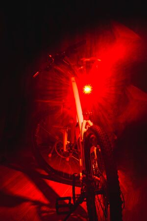 The rear of retro bicycle with brown leather seat and handle from perspective angleの写真素材