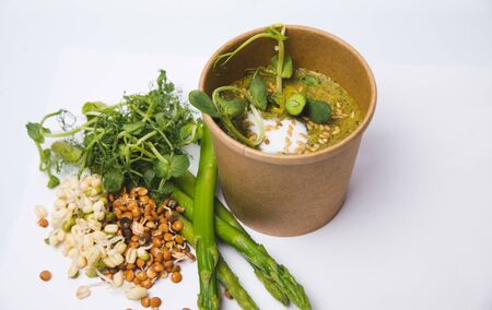 Asparagus soup cream with croutons on white woodenの写真素材