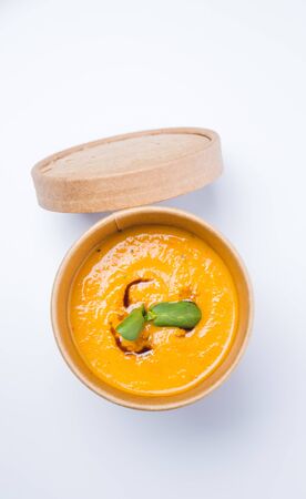 Broccoli spinach cream soup on rustic woodenの写真素材