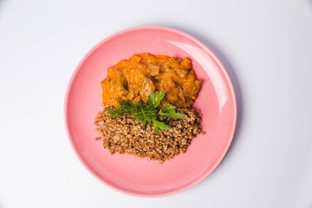 Meat goulash with buckwheat and mint leavesの写真素材