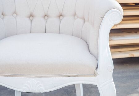 Three retro chair against a white wall.の写真素材