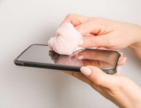 Hand with microfiber cloth cleaning car.の写真素材