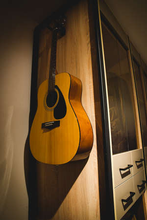 Beautifully designed bedroom with organized clothesの写真素材