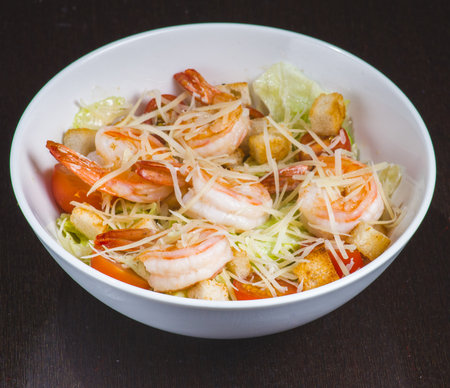 Healthy salad plate. Fresh seafood recipe. Grilled shrimp and fresh vegetable salad and egg. Grilled prawns. Health food. flat lay. top viewの写真素材