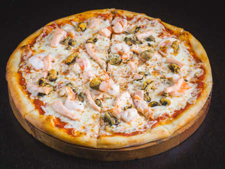 Many kinds of tasty pizza with salami, meat and chicken on light background. Table with many italian homemade pizza. flat lay foodの写真素材