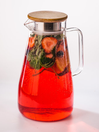 Lemonade or cocktail rhubarb, strawberry, mint, lemon and ice on light blue background. vertical formatの写真素材