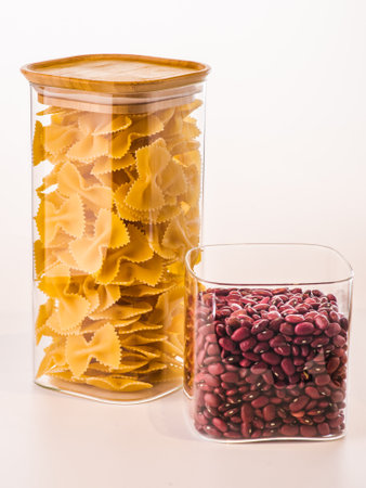 Pack of pasta in the hands of the buyer at the storeの写真素材