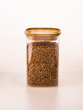 Glass jars with pasta, various cereals and grains. Food storage concept.の写真素材