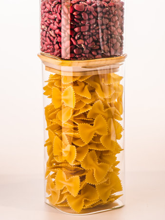 Pack of pasta in the hands of the buyer at the storeの写真素材