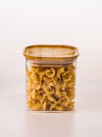Pack of pasta in the hands of the buyer at the store