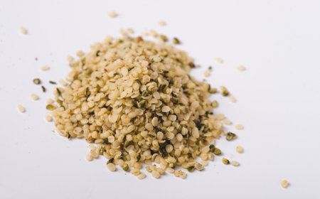 Heap of hemp seeds on white backgroundの写真素材