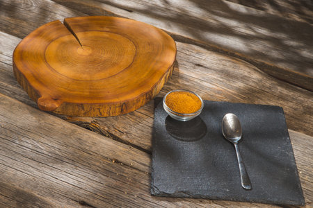 Bowl and scoop of brown sugar with coconut on wooden backgroundの写真素材