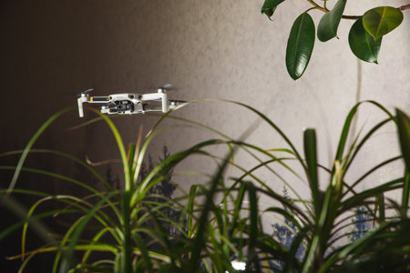 In the Military Staging Base Army Engineer and Soldiers Fly Military Grade Industrial Drone for their Reconnaisance/ Surveillance Mission/ Operation. Theater of Operation is in Forest Area.の写真素材