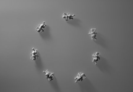 vertical. figurine of an angel Cupid with a bow on a pink background. Valentine's Day.の写真素材