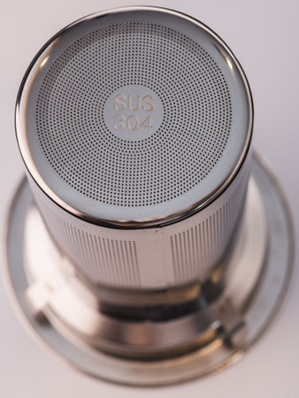 Stainless steel tea strainer infuser close up. Tool for flask or coffee mug with spill proof lid. mockup.の写真素材