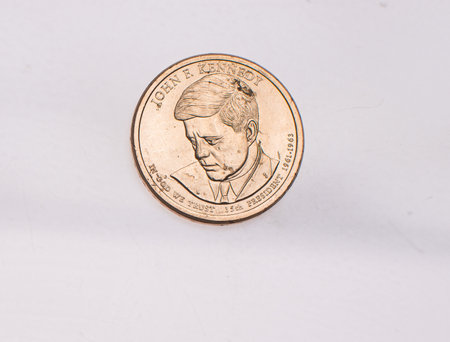 The four most commonly used American Coins. A quarter, dime, nickle, and penny isolated on a white backgroundの写真素材