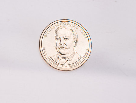 The four most commonly used American Coins. A quarter, dime, nickle, and penny isolated on a white backgroundの写真素材