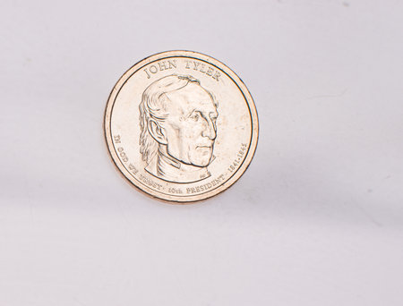 The four most commonly used American Coins. A quarter, dime, nickle, and penny isolated on a white backgroundの写真素材