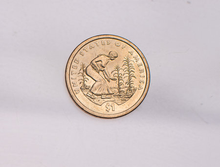 The four most commonly used American Coins. A quarter, dime, nickle, and penny isolated on a white backgroundの写真素材