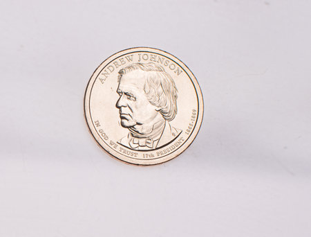 The four most commonly used American Coins. A quarter, dime, nickle, and penny isolated on a white backgroundの写真素材