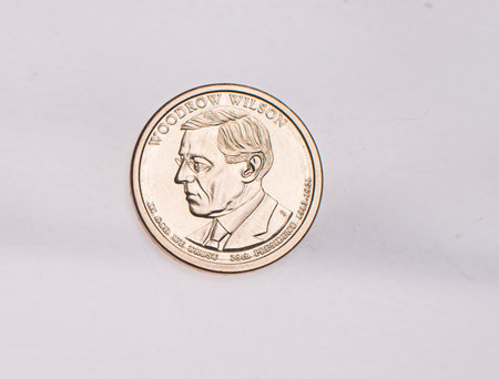 The four most commonly used American Coins. A quarter, dime, nickle, and penny isolated on a white backgroundの写真素材