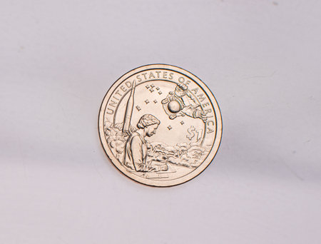 The four most commonly used American Coins. A quarter, dime, nickle, and penny isolated on a white backgroundの写真素材