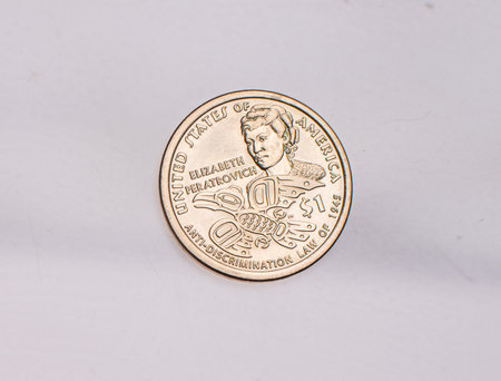 The four most commonly used American Coins. A quarter, dime, nickle, and penny isolated on a white backgroundの写真素材