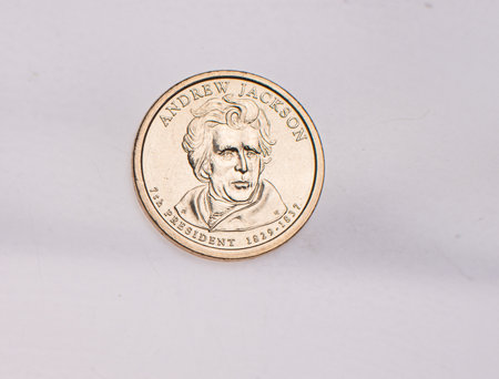 The four most commonly used American Coins. A quarter, dime, nickle, and penny isolated on a white backgroundの写真素材