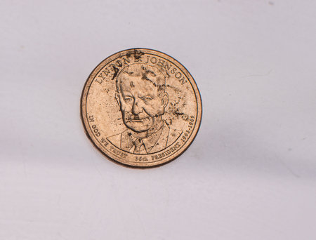 The four most commonly used American Coins. A quarter, dime, nickle, and penny isolated on a white backgroundの写真素材