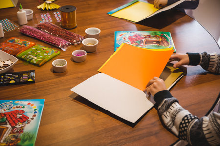 handicraft multi-colored paper flowers for mother's day, women's day on March 8, valentine's day. Children's master class. Scissors and rulers. child's leisureの写真素材