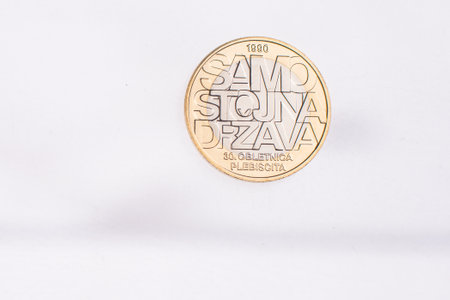 Used commemorative anniversary bimetal 3 euro Slovenia coin 2012. Worn out special three euro coin from Slovenia.の写真素材