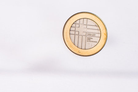 Used commemorative anniversary bimetal 3 euro Slovenia coin 2012. Worn out special three euro coin from Slovenia.の写真素材