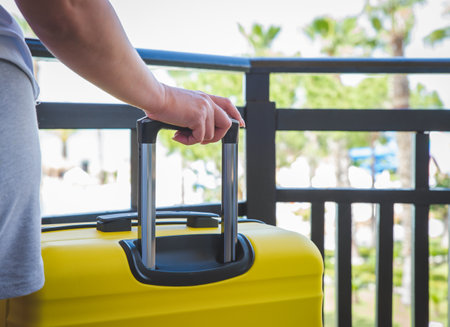 Travel. Staycation.local travel new normal.Girl packing luggage in suitcase and travel documents Travel,tourism,vacation,relocation.Mental health and travel vacation Film grainの写真素材