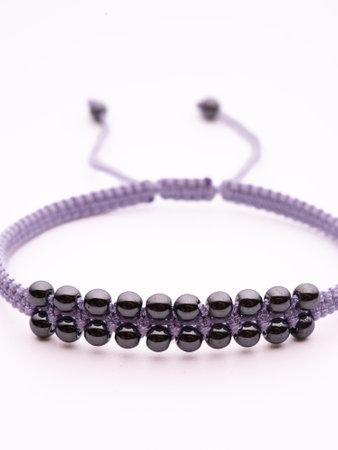 Black hematite handmade bracelet on white backgroundの写真素材
