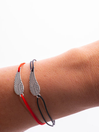 two pair bracelets are made of Korean rope and there is a love emblem that can be fused because there are magnets in it.の写真素材